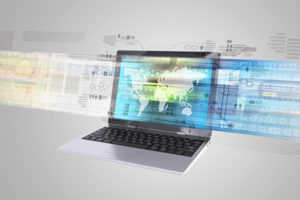 A new report examines some of the critical components necessary to drive a robust broadband access program like this laptop connected to high-speed internet.